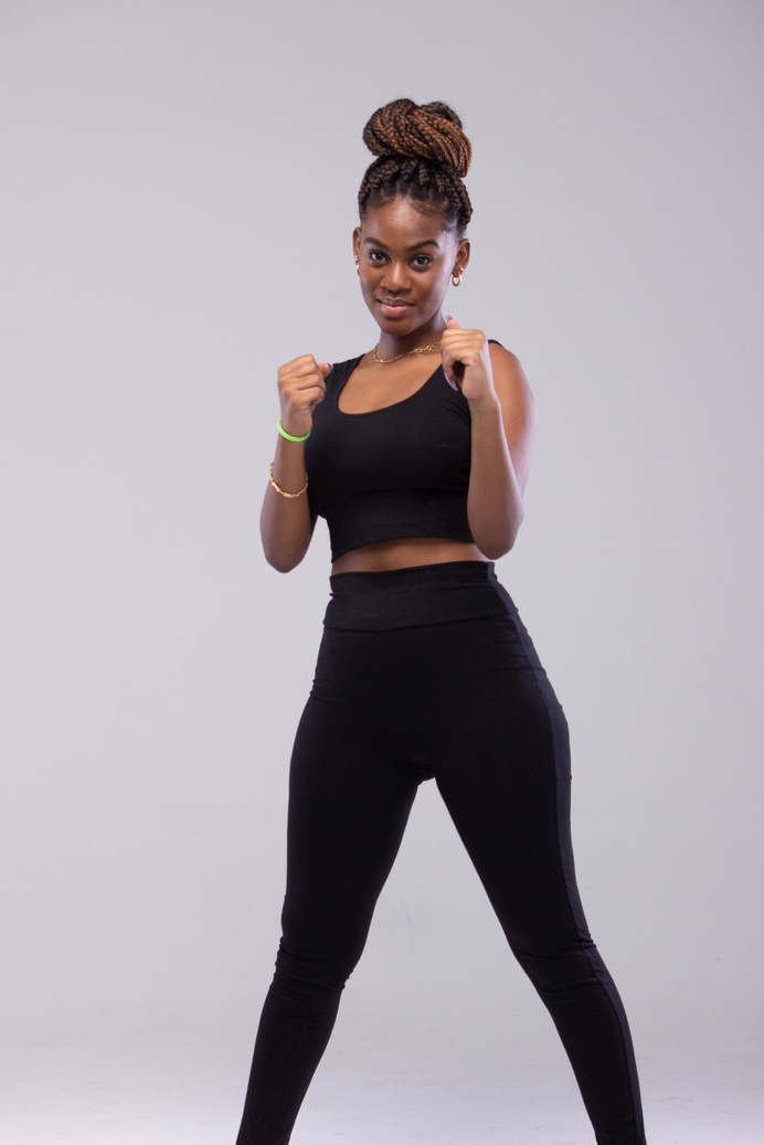Woman in Black Outfit in Boxer Posing